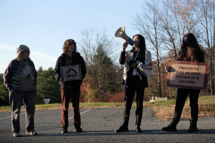 Dartmouth College student Kevin Engel, second from right, is joined in pro-Palestinian chants by Karen Bixler, of Bethel, left, fellow student Sean Wallace, second from left, and his co-defendant Roan Wade, right, outside Lebanon District Court on Monday, Oct. 28. About 20 people gathered outside the court with Engel and Wade after the conclusion of arguments in their trial to re-affirm their support for the Palestinian people. Dartmouth College student Kevin Engel, second from right, is joined in pro-Palestinian chants by Karen Bixler, of Bethel, left, fellow student Sean Wallace, second from left, and his co-defendant Roan Wade, right, outside Lebanon District Court on Monday, Oct. 28. About 20 people gathered outside the court with Engel and Wade after the conclusion of arguments in their trial to re-affirm their support for the Palestinian people.