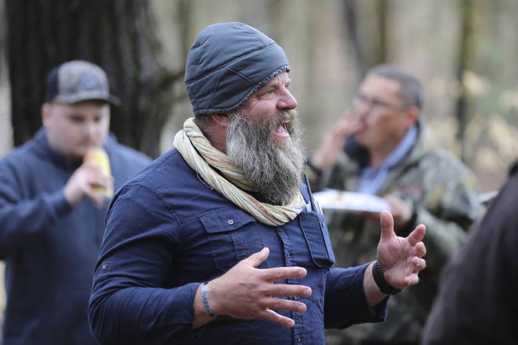FILE - Daniel Banyai, the owner of Slate Ridge, speaks to supporters, April 17, 2021, in West Pawlet, Vt., during a Second Amendment Day Picnic at the unpermitted gun range and firearms training center. A judge has again issued an arrest warrant, Monday, Dec. 4, 2023, for Banyai, the owner of the former firearms training center in Vermont, ruling that he is in contempt of court for failing to bring his property into compliance after an inspection last week. Monday's ruling orders...