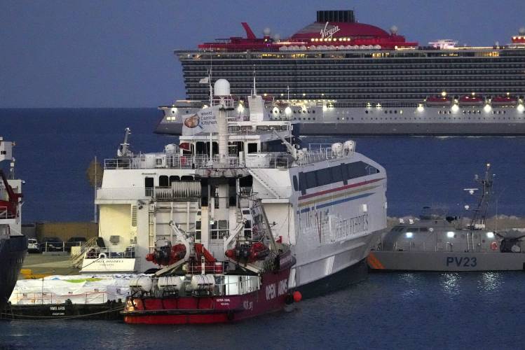 Aid packages are seen at left, on a platform near to the docked ship belonging to the Open Arms aid group, center front, as it prepares to ferry some 200 tonnes of rice and flour directly to Gaza, at the port in Larnaca, Cyprus, Monday, March 11. Aid packages are seen at left, on a platform near to the docked ship belonging to the Open Arms aid group, center front, as it prepares to ferry some 200 tonnes of rice and flour directly to Gaza, at the port in Larnaca, Cyprus, Monday, March 11.
