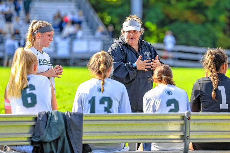 Pembroke Academy head coach Jess Kaufman-Desrochers speaks with her players at halftime during a Division II girls' soccer game at Merrimack Valley High School on Sept. 28. Kaufman-Desrochers won the Preston Eames Award for her contributions to soccer in the state of New Hampshire. Kaufman-Desrochers has coached the Spartans for 15 years and is also the coaches association's secretary and board member.
