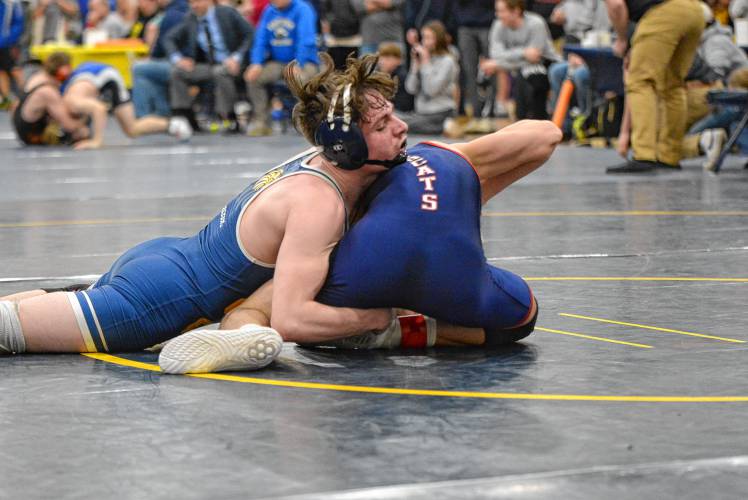Bow’s Jacob Coulon (top) wrestles Plymouth’s Kody Sawyer in the 138-pound quarterfinals at the Division III state championship on Saturday at ConVal Regional High School in Peterborough. Coulon went on to win the 138 title, a highlight of the Falcons’ team state title repeat.
