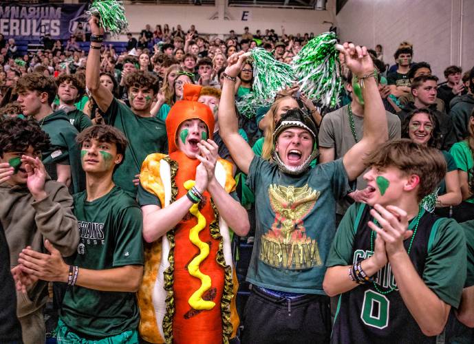 Pembroke students begin to celebrate in the closing moments of the D-II boys’ basketball championship. Pembroke beat Sanborn, 63-54, on Sunday.