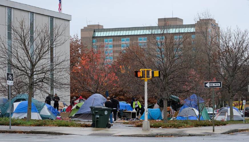 A homeless encampment popped up on state-owned land in Manchester this summer.