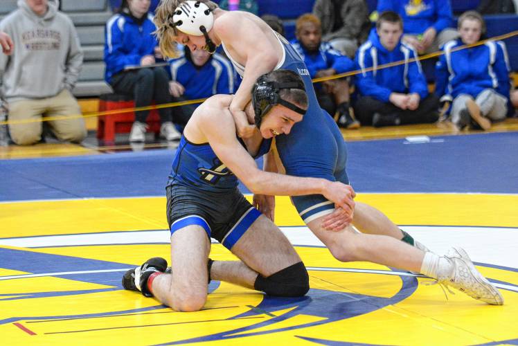 Bow’s Herbie Madden wrestles Pelham’s Drew Nicolosi in a 144 pound round of 16 bout at the Division III state championship on Saturday at ConVal Regional High School in Peterborough. Madden went on to finish third at 144. 
