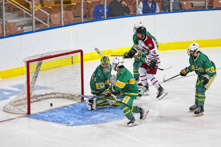 Concord senior Rowan Arndt scores the game-winning goal to dramatically end the longest championship game in NHIAA hockey history with a 2-1 victory in the fourth overtime period.
