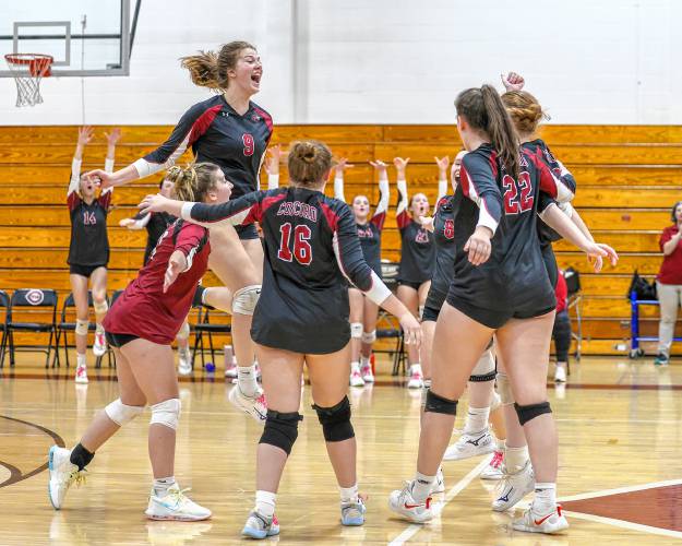 Brooke Wyatt (9) and her teammates celebrate a point during Wednesday’s preliminary round matchup against Pinkerton.
