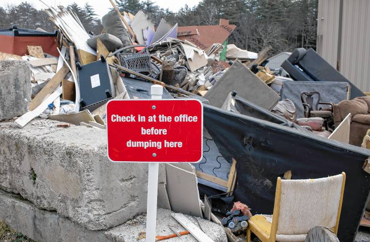 A sign in front of a building materials dumping area at the Hopkinton Webster Transfer Station in Hopkinton on Wednesday, January 3, 2024.