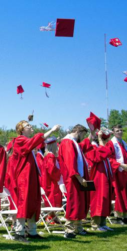 Concord High School graduates throw up their caps  at Memorial Field after receiving  their diplomas on Saturday, June 15, 2024.