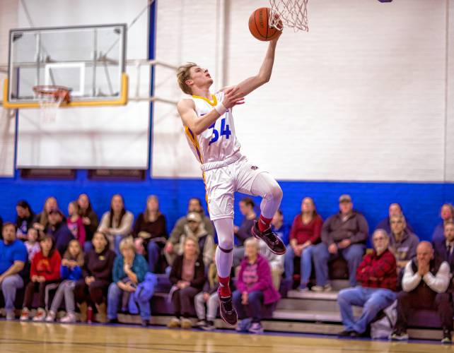 Franklin forward Harrison Kaplan soars as he drives to the basket during the first half on Friday.
