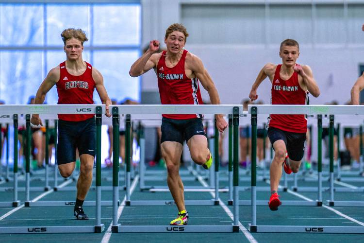 Coe-Brown’s Cameron Lee (center) races in the 55-meter hurdles on Saturday at Plymouth State. Lee won the hurdles in 8.07 seconds and also finished fourth in the 300 to lead Coe-Brown to third a a team.