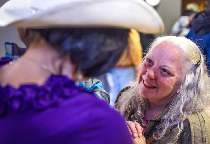 Bonnie Mae Whittemore talks with her friend Deborah Eckland at the memorial service for Rodney Moody that  brought out friends and part of the unhoused community on Saturday, March 30, 2025.  Moody died at the Concord Coalition to End Homelessnessâs winter shelter on February 23rd. After the service, a group walked in a procession from CenterPoint Church on North State over to the shelter in honor of Moody.