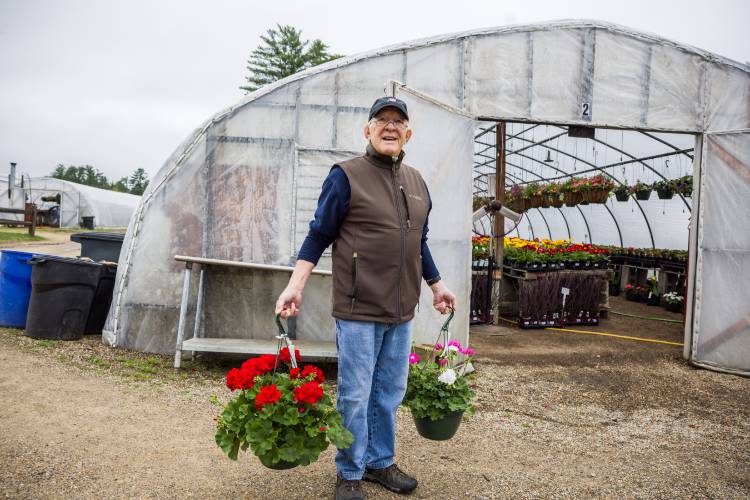 Jef Demarie shops for Geraniums at Appletree Nurseries in Tilton. Demarie’s grandfather love of gardening was passed on to him even when he has limited space where he lives.