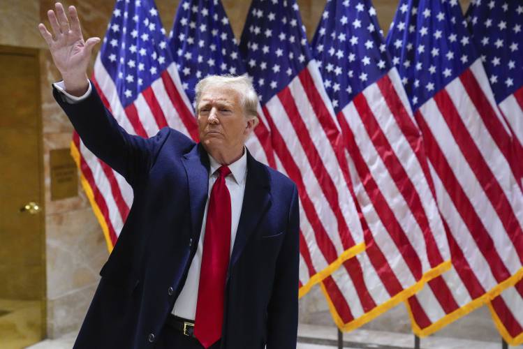 Former President Donald Trump waves to supporters during a news conference, Wednesday, Jan. 17, 2024, in New York. (AP Photo/Frank Franklin II)