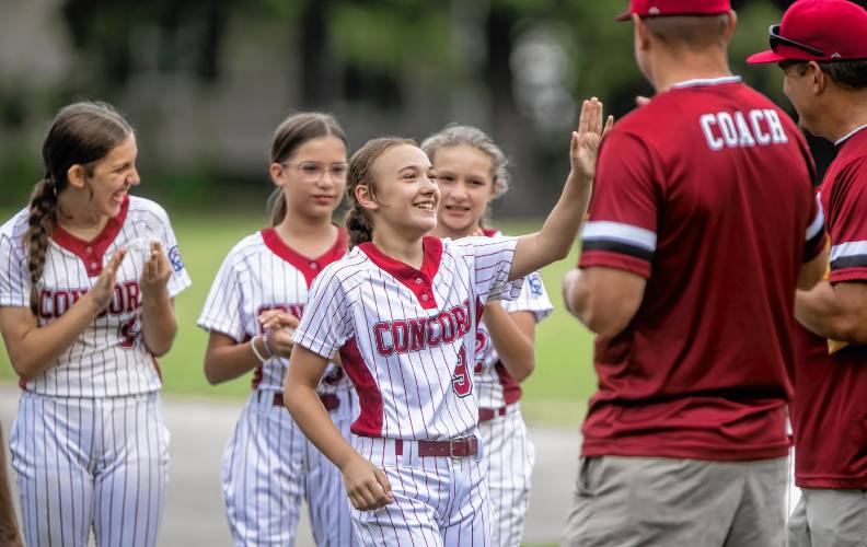 Catcher Pippa Tupman gets her pin for being on the Concord Little League team that will be going to Bristol, Connecticut later this month.