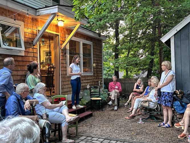 Candidate for New Hampshire’s second congressional district, Maggie Goodlander, talks to prospective voters at a recent Concord house party.