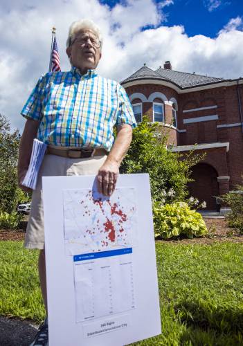 Jeff Wells from Concerned Citizens for Concord holds the 1,500 petition signatures in front of the School District building on Monday, August 15, 2024. The group submitted its petitions to put changes to the school district charter on the ballot this fall. Wells and the group also made a map showing where all the signatures came from. Jeff Wells from Concerned Citizens for Concord holds the 1,500 petition signatures in front of the School District building on Monday, August 15, 2024. The group submitted its petitions to put changes to the school district charter on the ballot this fall. Wells and the group also made a map showing where all the signatures came from.