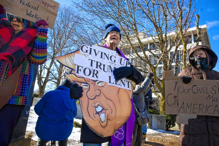 LEFT: Mark Ferrin came all the way from Farmington to protest in front of the Federal Building.