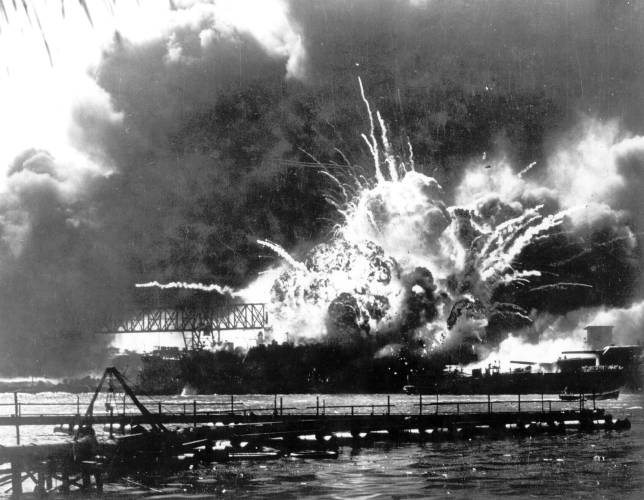FILE - In this photo released by the U.S. Navy, the destroyer USS Shaw explodes after being hit by bombs during the Japanese surprise attack on Pearl Harbor, Hawaii, December 7, 1941. The Navy and the National Park Service will host a remembrance ceremony Thursday, Dec. 7, 2023, marking the 82nd anniversary of the attack on Pearl Harbor that launched the U.S. into World War II. (U.S. Navy via AP, File)