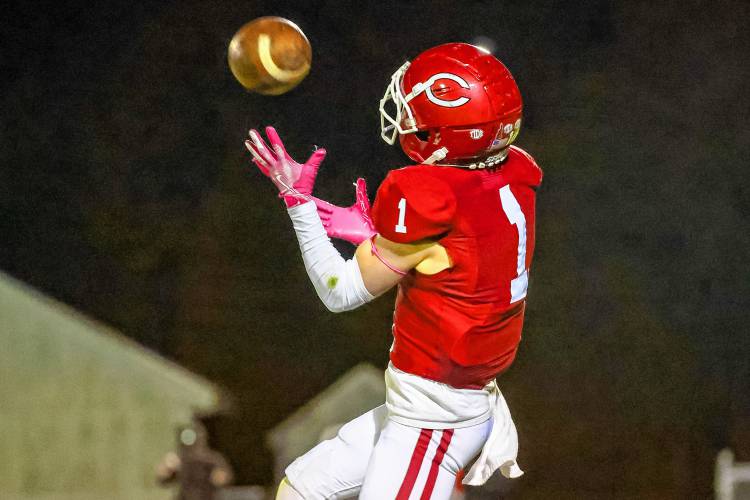 Concord’s Trevor Craigue (1) hauls in a catch for a touchdown in the second quarter of a game against Manchester Memorial on Thursday at Memorial Field. Craigue scored a pair of touchdowns to lead the Tide past the Crusaders, 21-12, Manchester Memorial's first loss of the season.