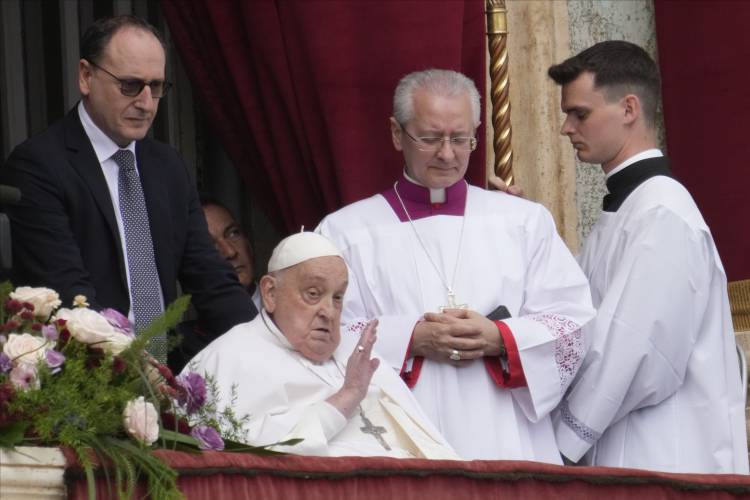 Pope Francis appears on the central lodge of St. Peter's Basilica to bestow the Urbi et Orbi (Latin for to the city and to the world) blessing at the end of the Easter mass presided over by Cardinal Angelo Comastri in St. Peter's Square at the Vatican Sunday, April 20, 2025.(AP Photo/Gregorio Borgia)