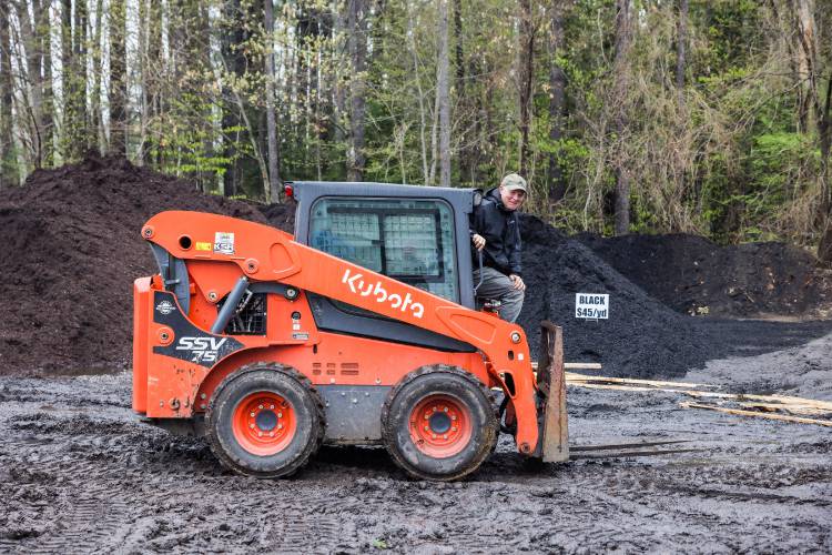 Owner David Rotonnelli stips out of his Kubota loader after receivign a bush delivery at Appletree Nurseries in Tilton on Tuesday, May 6, 2025. The nursery has been in the Rotonnelli family for 32 years.