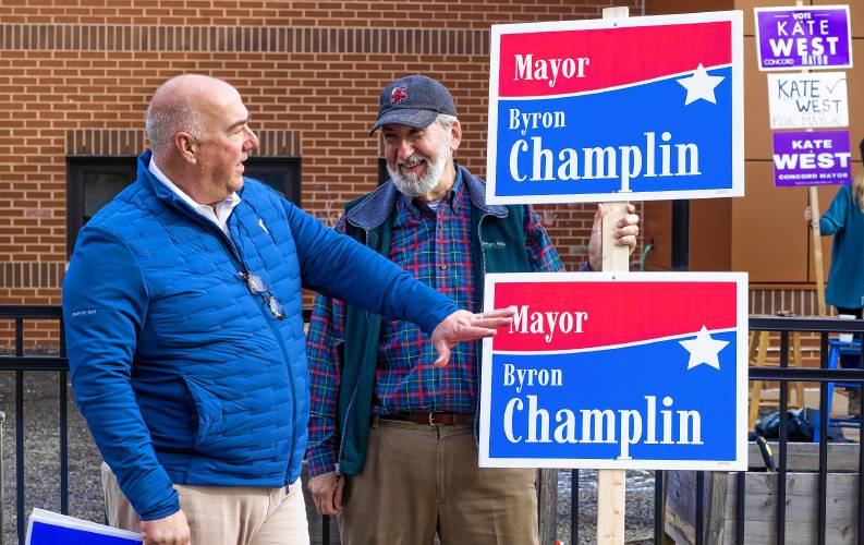 Mayor Jim Bouley talks with mayoral candidate Byron Champlin at the Ward 5 polling place at Christa McAuliffe Elementary on Tuesday, November 7, 2023.