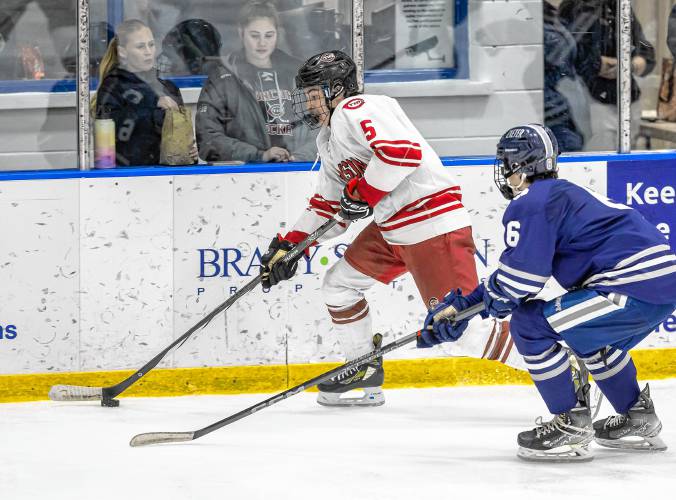 FILE – Concord’s Jaden Haas (5) carries the puck up the ice during the third-place game at the Brian C. Stone Memorial Christmas Tournament at JFK Coliseum in Manchester on Dec. 28. Exeter defeated Concord, 4-3, to win the bronze.