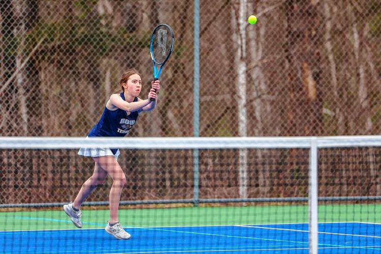 Makaylie Laws follows through on a backhand during Bow's season-opening match against Coe-Brown on Tuesday April 2, 2024.