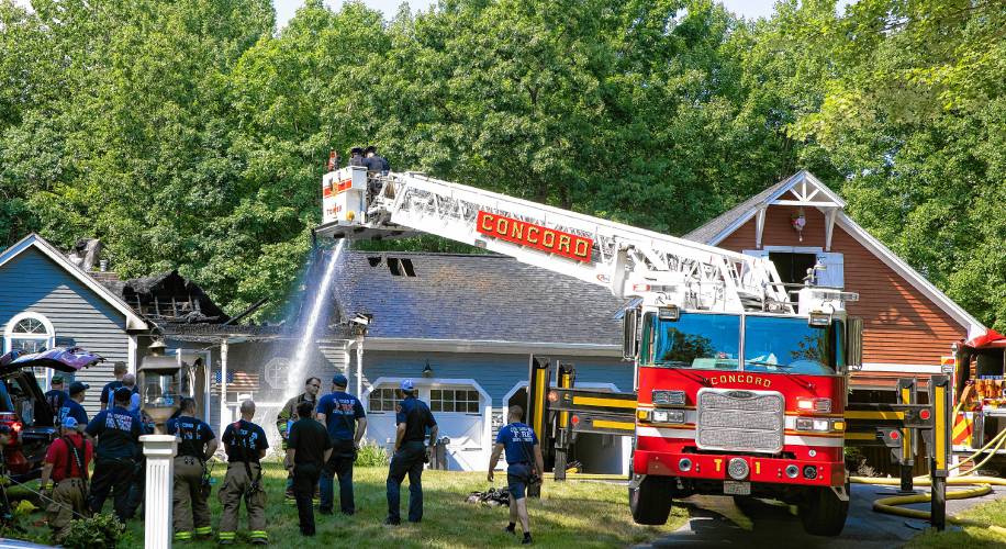 Concord Tower One sprays water on the middle of the Elm Street house on Saturday, Juy 13, 2024.