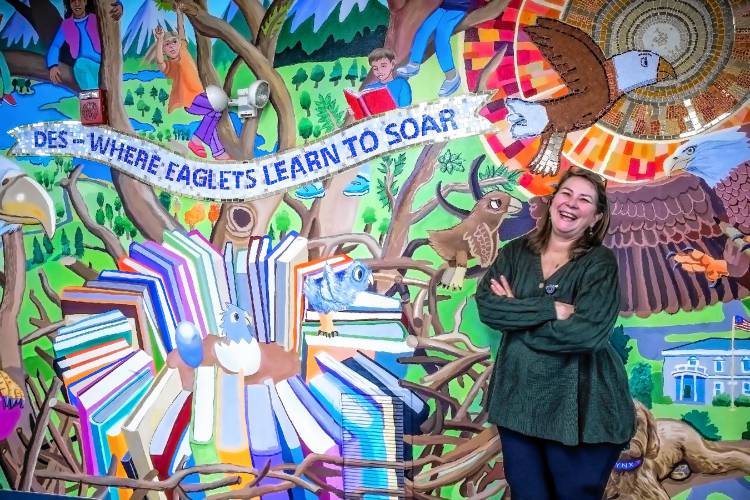 Shelley Westenberg, the principal’s secretary at Dunbarton Elementary, at the school mural on Jan. 29.