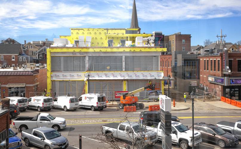 Construction of the Friendly Toast and Arts Alley in downtown Concord is taking shape. The structure is seen from the top of the parking garage.
