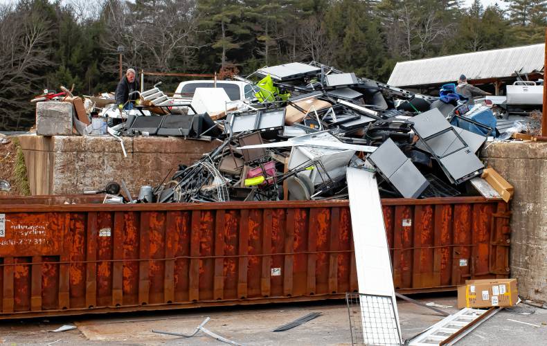 A pile of building materials is loading onto a recycling container at the Hopkinton Webster Transfer Station on Wednesday, January 3, 2024.
