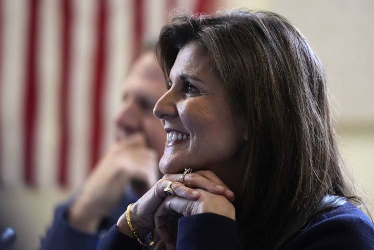 Republican presidential candidate former UN Ambassador Nikki Haley listens to students during a campaign stop at the Polaris Charter School, Friday, Jan. 19, 2024, in Manchester, N.H. (AP Photo/Charles Krupa) 