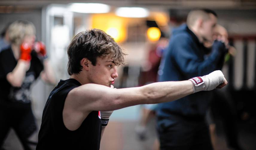 Ronny Philbrick warms up for his boxing class at Averill's Boxing in downtown Concord on March 7, 2024. Philbrick is hoping to box in the future and takes the class with his brother, Ritchie.