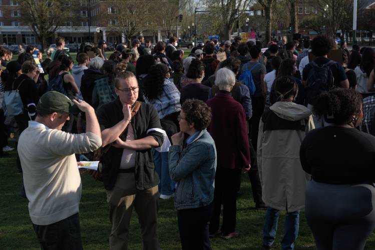 Calvin George, middle, of the Dartmouth New Deal Coalition, negotiates with Dartmouth administrators Eric Ramsey, associate dean for student life left, and Emma Wolfe, vice president for government and community relations, right, during a protest of the Israel-Hamas War on the Dartmouth College Green in Hanover, N.H., on Wednesday, May 1, 2024. (Valley News - James M. Patterson) Copyright Valley News. May not be reprinted or used online without permission. Send requests to permission@vnews.com.