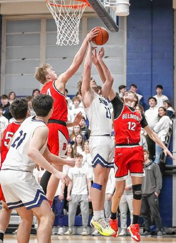 Belmont’s Anakin Underhill blocks a St. Thomas shot during a Division III quarterfinal basketball game at St. Thomas Aquinas High School in Dover. No. 2 St. Thomas had a big third quarter to defeat No. 7 Belmont, 67-50.