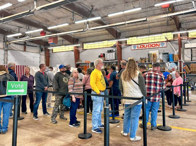 At the Arthur Colby Safety Center and Fire Department in Loudon, voters wait in line to cast their ballot. Nearly 1,900 had done so by 1 p.m.
