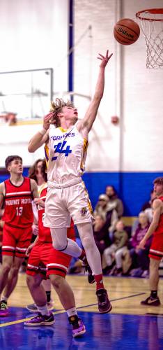 Franklin forward Harrison Kaplan soars above the Mount Royal players as he drives to the basket during the first half on Friday.