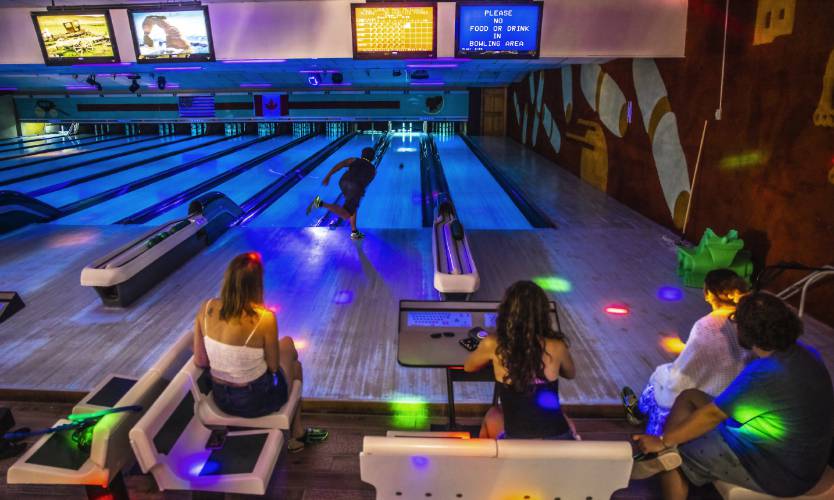 Ignacio Anguiano watches his ball go down the alley during glow bowling night at Boutwell’s on Saturday. It was Anguiano’s birthday and he came with friends to bowl. Twenty-four teams from the Northeast and Canada will be coming to Boutwell’s  this weekend.