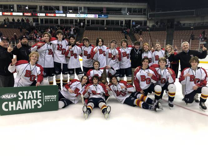 The No. 1 Belmont-Gilford Bulldogs (19-1) celebrate after their 4-1 victory over No. 2 Berlin-Gorham to claim the 2023 Division III boys’ hockey championship on Saturday, March 11, 2023 at SNHU Arena in Manchester. The Bulldogs had a dominant 2022-23 season, outscoring opponents 120-21 over their 20 games.