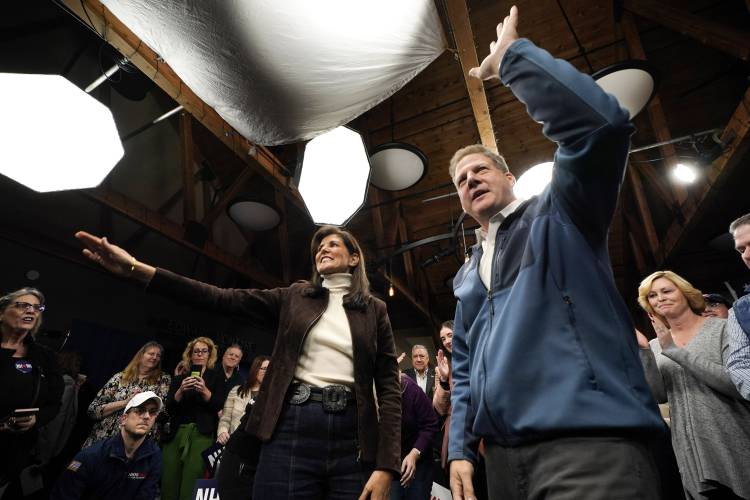 Republican presidential candidate Nikki Haley and Gov. Chris Sununu appear at a town hall campaign event where Haley received the New Hampshire governor's endorsement, Tuesday, Dec. 12, 2023, in Manchester, N.H. (AP Photo/Robert F. Bukaty) 
