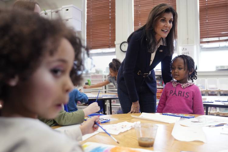 Republican presidential candidate former UN Ambassador Nikki Haley talks with students during a campaign stop at the Polaris Charter School, Friday, Jan. 19, 2024, in Manchester, N.H. (AP Photo/Charles Krupa) 