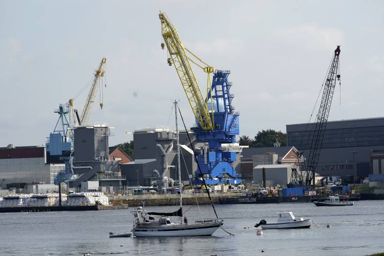 FILE - The Portsmouth Naval Shipyard is seen, Wednesday, Sept. 8, 2021, in Kittery, Maine. Americans lament the lack of good-paying manufacturing jobs, but defense contractors are having trouble filling the ones that still exist in Maine. Defense contractors, community colleges and universities, the U.S. Navy and others announced an alliance Friday, March 1, 2024 to accelerate workforce training to help prepare thousands of workers for defense jobs like those at Pratt & Whitney,...