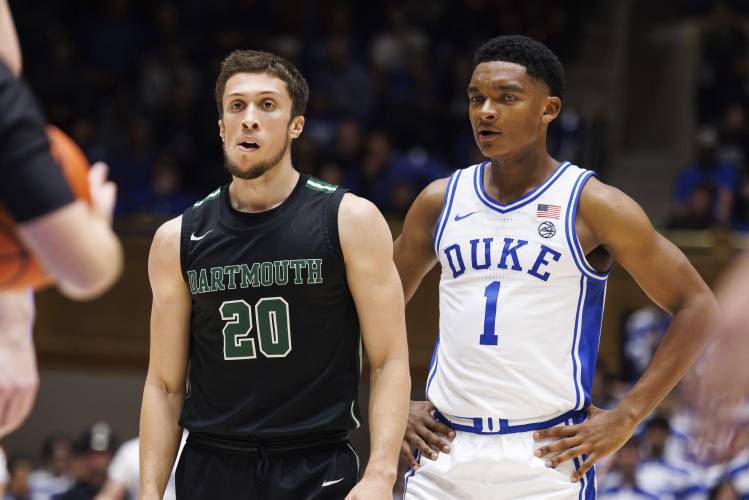 FILE -Dartmouth's Romeo Myrthil (20) stands next to Duke's Caleb Foster (1) during the second half of an NCAA college basketball game in Durham, N.C., Monday, Nov. 6, 2023. Romeo Myrthil and Cade Haskins, two Dartmouth players working to unionize their basketball team say other athletes — both on campus and from other Ivy League schools — have been reaching out to see if they can join the effort, Saturday, Feb. 10, 2024. (AP Photo/Ben McKeown, File)
