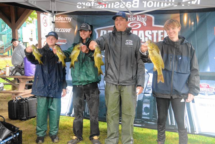 John Stark’s Jayden Bishop (far left), Ronnie Martin (left center), Connor Boudreau (right center) and Eli Marquardt (far right) pose with their catch at the bass fishing state qualifying tournament at Lake Winnipesaukee on Thursday.