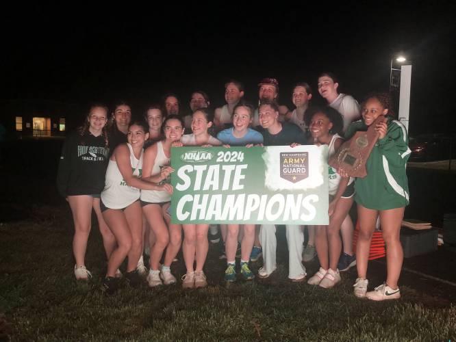 The Hopkinton girls’ track and field team poses with hardware after winning the Division III team title at Winnisquam Regional High School on May 23. The Hawks only graduated one girl from last year’s team and are reloaded in 2025.