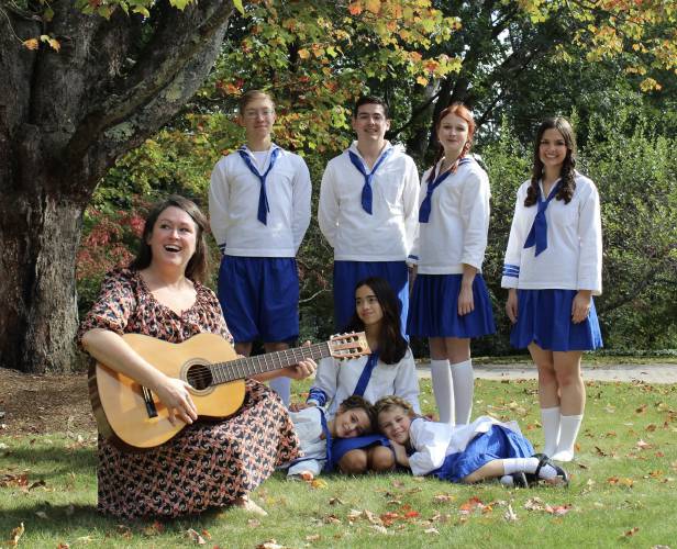Ally Thorpe (as Maria) and the seven Von Trapp children: Max Yakubwich (Kurt), Tom Lott (Friedrich), Annie Lelio (Liesl) and Holly Keenan (Louisa). Abby Durell (Birgitta) is laying on the ground with “real life” sisters, Violet Curran (Gretyl)  and Hazel Curran (Marta).