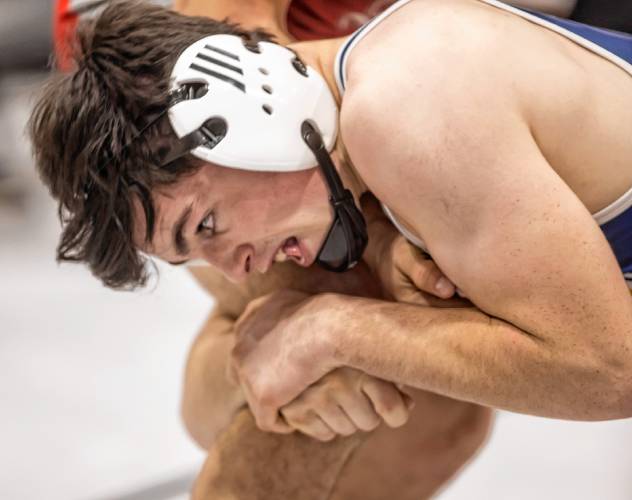 Bow senior Ben McDowell hangs on to Nels DeAlmeida of Pinkerton Academy during their semifinal 165-pound match at the Capital City Classic on Saturday. McDowell won the match and finished as the 165 runner-up, helping the Falcons finish fourth out of 25 teams.