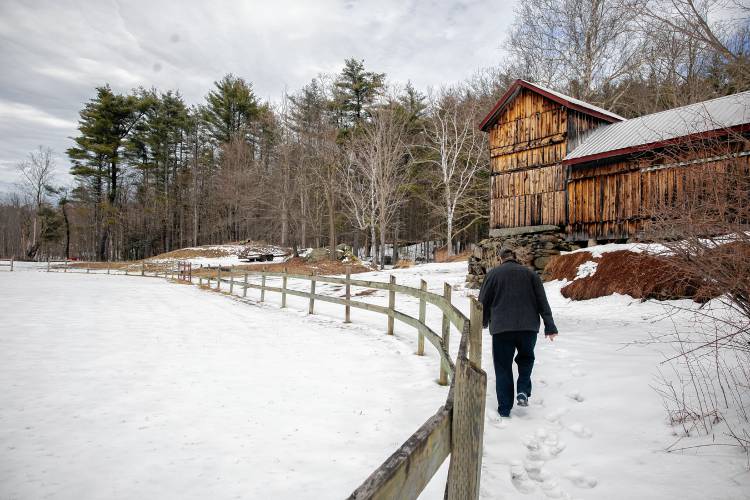 Roy Plisko walks along what once was the judgeâs booth for horse competitions in his mother’s barn at her farm in Canterbury on Wednesday, March 27, 2024. New Hampshire Horse Council’s Board of Directors named his mother, Virginia LaPlante, New Hampshire's 2024 Horse Person of the Year.