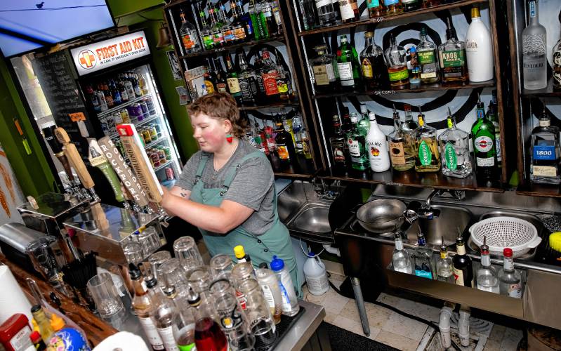 Anastasia McNeil pours a draft at the  Forum Pub in Penacook on Friday, July 26, 2024.